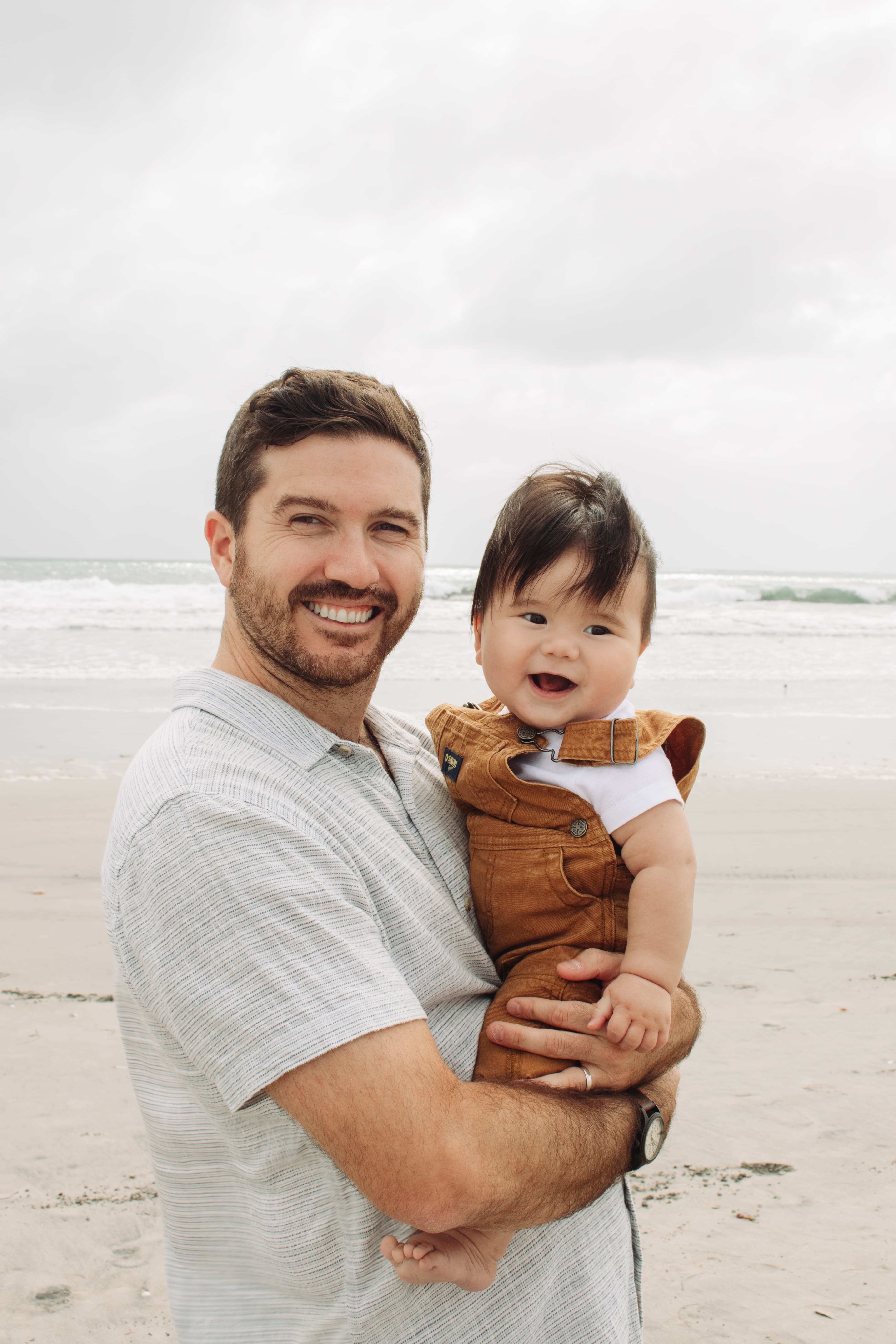 Nolan Schmalenberger with his child at the beach